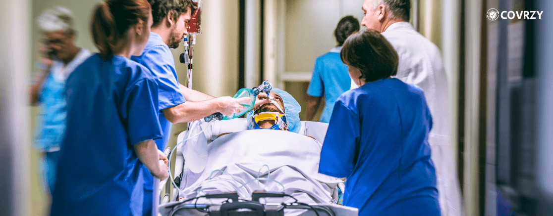 Few nurse and a doctor are taking a patient with saline condition in a stretcher