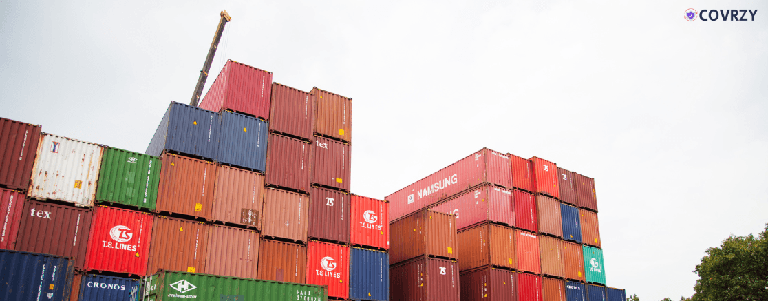 few boxes of commodities stacked on each other in an open field